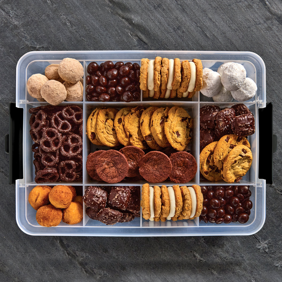 Top view of Snacklebox open to reveal cookies, grapes and other snacks in separate compartments