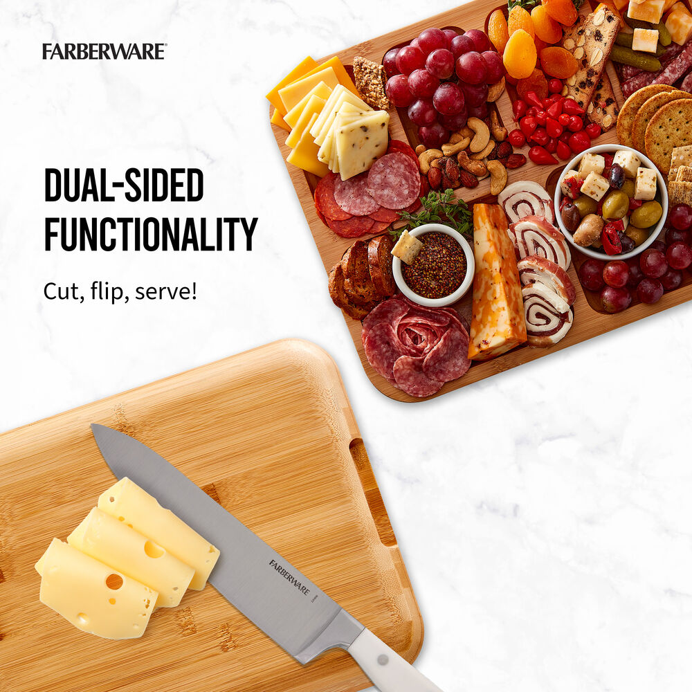 Bamboo cutting board with a cheese knife and assorted cheeses and meats
